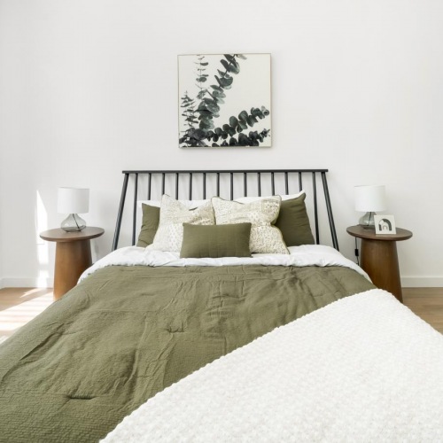 Beautiful bedrooms to fit every need a bed with a white bed spread