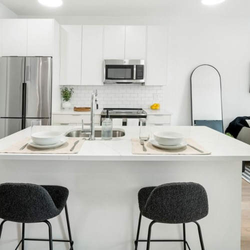 Wide open living areas perfect for entertaining a kitchen with a table and chairs